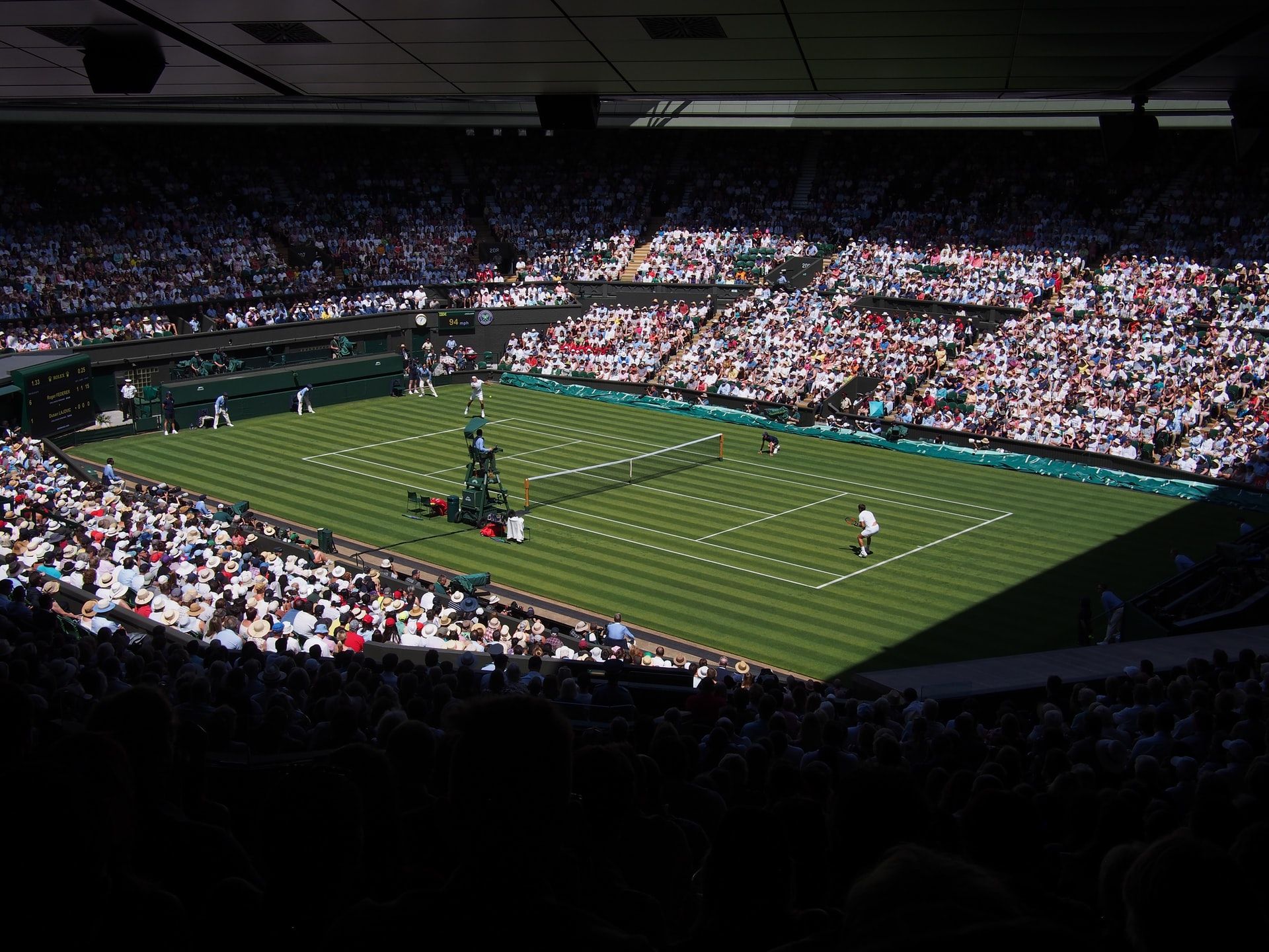 Ilustrasi pertandingan tenis lapangan dalam kejuaraan Wimbledon (Unsplash/Shep Mcallister)